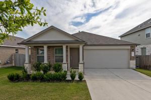 a brick house with a white garage at Spacious 3/2 Kalahari Waterpark in Round Rock