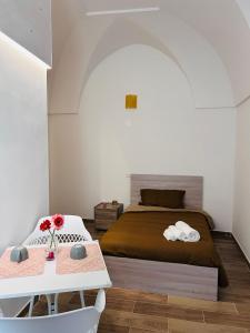 Ліжко або ліжка в номері Le Camere Dei Mascia