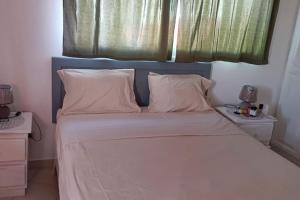 Postel nebo postele na pokoji v ubytování El Rinconcito Caribeño