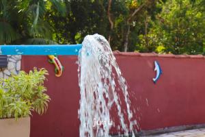 Bazén v ubytování Recanto Pousada JU&JU com piscina COMPARTILHADA nebo v jeho okolí