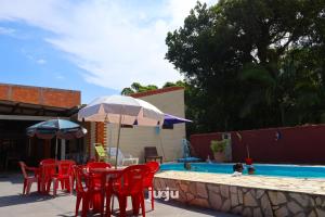 Bazén v ubytování Recanto Pousada JU&JU com piscina COMPARTILHADA nebo v jeho okolí