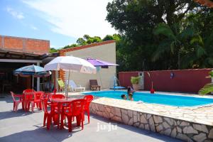 Bazén v ubytování Recanto Pousada JU&JU com piscina COMPARTILHADA nebo v jeho okolí