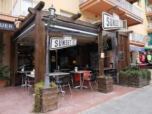 a restaurant with tables and chairs outside of it at Domuum Holidays - BARCELONA Family Home in Salou