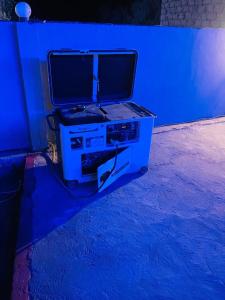 a gaming system with a monitor on top of it at Royal Resort Skardu in Skardu