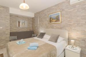 Postel nebo postele na pokoji v ubytování Rooms and apartments PALMA B&B