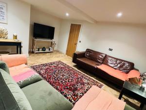 TV i/ili multimedijalni sistem u objektu WM Garden Cottage