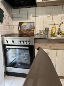a kitchen with a stove and a counter top at VALANTIS APARTMENT in Kavála