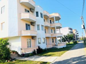 a building with balconies on the side of it at Urban Apartments in Ulcinj