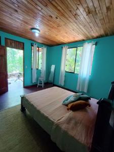 Cama ou camas em um quarto em PachaMama Bio