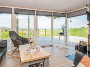 a living room with a view of the ocean at 6 person holiday home in Lemvig-By Traum in Lemvig