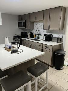 a kitchen with a counter and a stove top oven at Modern 3 Bedroom Close to Downtown Chicago in Chicago