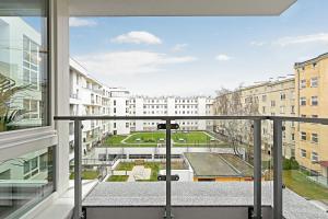 a balcony with a view of a building at Sleepy3city Apartments Batorego 9 in Gdynia