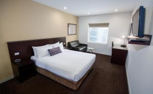 Postel nebo postele na pokoji v ubytování Atlantis Hotel Melbourne