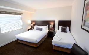 Postel nebo postele na pokoji v ubytování Atlantis Hotel Melbourne