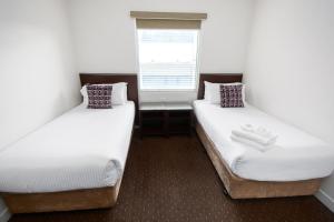 Postel nebo postele na pokoji v ubytování Atlantis Hotel Melbourne