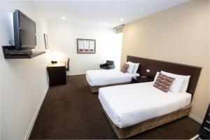 Postel nebo postele na pokoji v ubytování Atlantis Hotel Melbourne