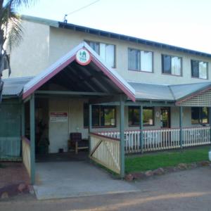 a building with a porch in front of it at Kalbarri Inn in Kalbarri
