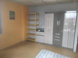 an empty room with a bed and a closet at Jack Appart (departamento 2 cuartos y terraza) in Arequipa