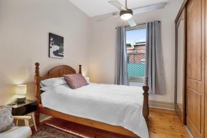 a bedroom with a large bed and a window at City Edge Home From Home in Keswick