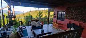 a screened in porch with a view of a mountain at Altos de Chulavista Constanza in Constanza