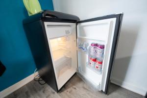 a refrigerator with its door open in a room at Cozy Hollywood Get Away in Los Angeles