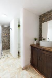 a bathroom with a sink and a toilet at Altos de Chulavista Constanza in Constanza