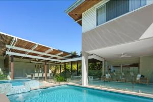 an image of a swimming pool in a house at Witta Circle - Walk to Hastings St & Noosa Beach in Noosa Heads