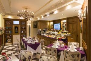 a restaurant with purple tables and chairs and a buffet at GLK PREMIER Sea Mansion Suites & Spa - Special Class in Istanbul
