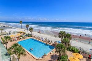 an overhead view of a swimming pool and a beach at Oceanfront Condo at Daytona Beach Resort in Daytona Beach