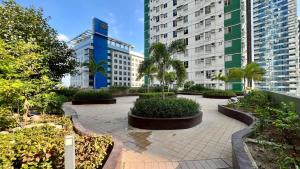 a courtyard in a city with tall buildings at Highview IT Park in Cebu City
