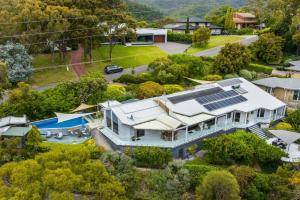 an aerial view of a house with solar panels on it at Amazing view Skye heated Pool&hot Spa & sauna in Norton Summit