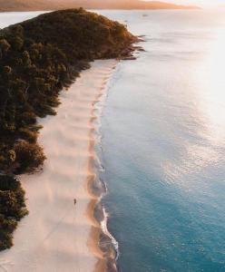 an aerial view of a beach in the ocean at Great Keppel Island Hideaway in Great Keppel