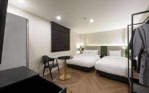 Postel nebo postele na pokoji v ubytování Hotel Yaja Gwangalli