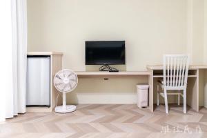 TV a/nebo společenská místnost v ubytování 台東市區維拉包棟民宿 附廚房及電動麻將