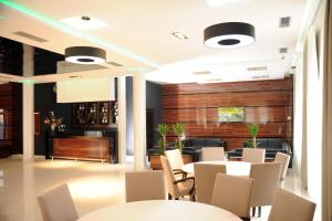 Restaurant o un lloc per menjar a Garni Uni Elita Lux Hotel