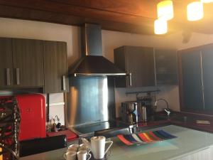 a kitchen with a sink and a stove top oven at Casa rural Adoracion Chipude - Adults Only in Chipude