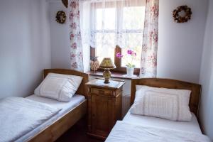Postel nebo postele na pokoji v ubytování Penzion U Jindry