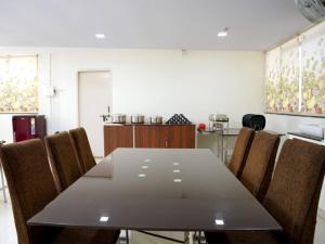 a dining room with a table and chairs at UNIQUE HOMESTAYS in Kondapur
