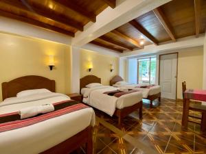 Postel nebo postele na pokoji v ubytování Mistico Machupicchu Eco B&B