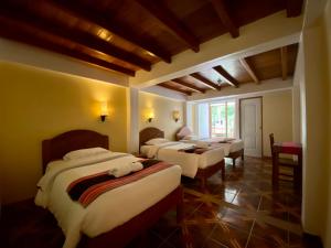 Postel nebo postele na pokoji v ubytování Mistico Machupicchu Eco B&B