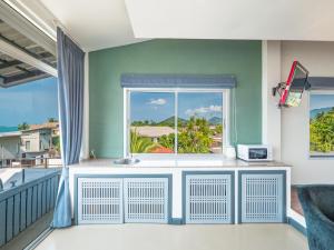 a balcony with a window and a basketball hoop at Lemon House apartment in Koh Samui 