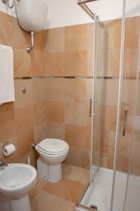 a bathroom with a toilet and a shower at Villa Marianna in Vasto