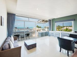 a living room with a view of the ocean at Lemon House apartment in Koh Samui 