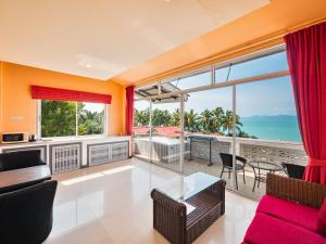 a living room with a view of the ocean at Lemon House apartment in Koh Samui 