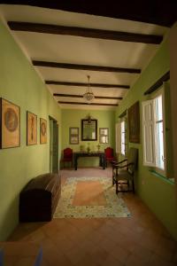 a living room with a couch and a table at Palazzo Santa Maria - Fondazione Meeting del Mare C.R.E.A. in Camerota