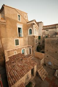 an overhead view of a building with a tile roof at Palazzo Santa Maria - Fondazione Meeting del Mare C.R.E.A. in Camerota