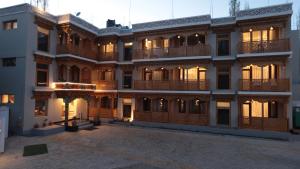 an exterior view of a building at dusk at Hotel Youthok Heritage in Leh