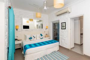 The Tamarind Hotel - A Boutique Heritage Stay, Anjuna - Goa客房内的一张或多张床位