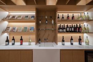 a display of bottles of wine on a counter at The Hyoosik Aank Hotel Wooam in Cheongju