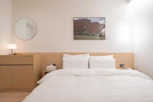 Aank Hotel Cheongju Uam 1st客房内的一张或多张床位